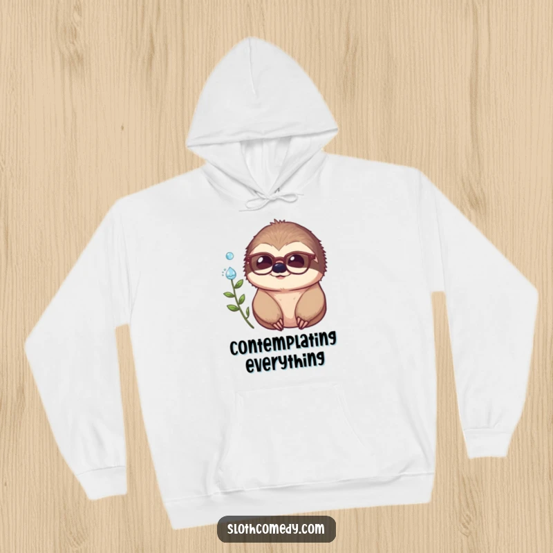 Funny hoodie depicting a studious sloth in spectacles, intently watching a dewdrop, ideal for screen readers who love humor.