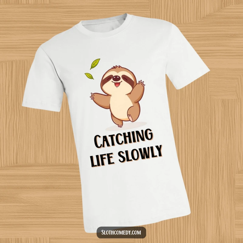 Funny t-shirt depicting a sloth comically reaching for a falling leaf, symbolizing a humorous struggle and determination.